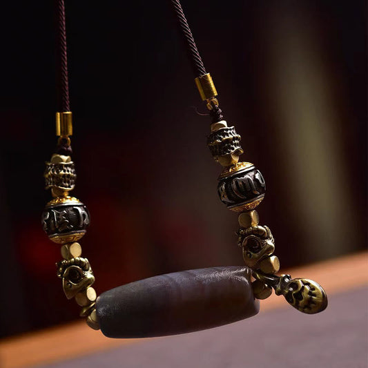 Tibetan Dzi Bead Agate Protection Pendant – hanging close-up, carved metal beads and barrel agate focal, spiritual pendant...