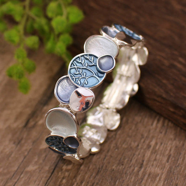 Tree of Life Alloy Elastic Bracelet – blue-toned enamel on weathered wood, sky blue medallion, elevated