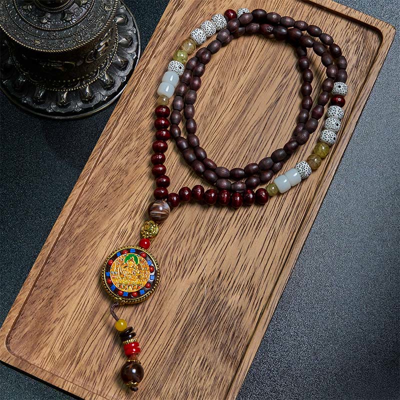Tibetan Om Mani Padme Hum Necklace – Full mala on wood tray, cloisonné deity pendant, dark fabric backdrop