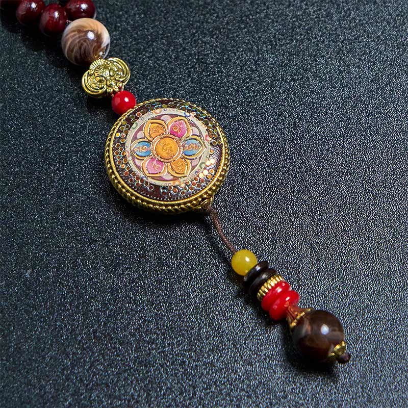 Tibetan Om Mani Padme Hum Necklace – Macro detail of lotus mandala pendant, gold filigree border, tassel beads