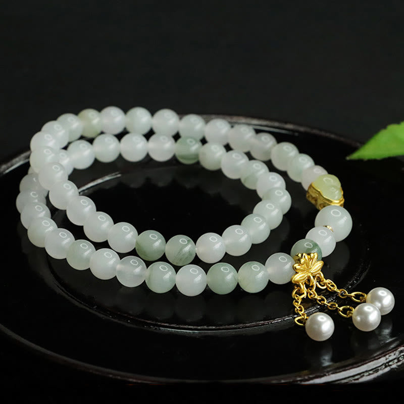 Tianshan Jade Lotus Gourd Bracelet – Dual-strand pale celadon beads coiled on lacquer dish, lotus jewelry