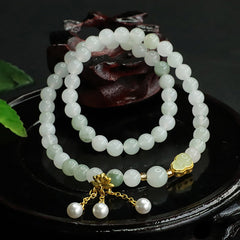 Tianshan Jade Lotus Gourd Bracelet – Pale beads with gold heart charm beside carved wood, jade bracelet