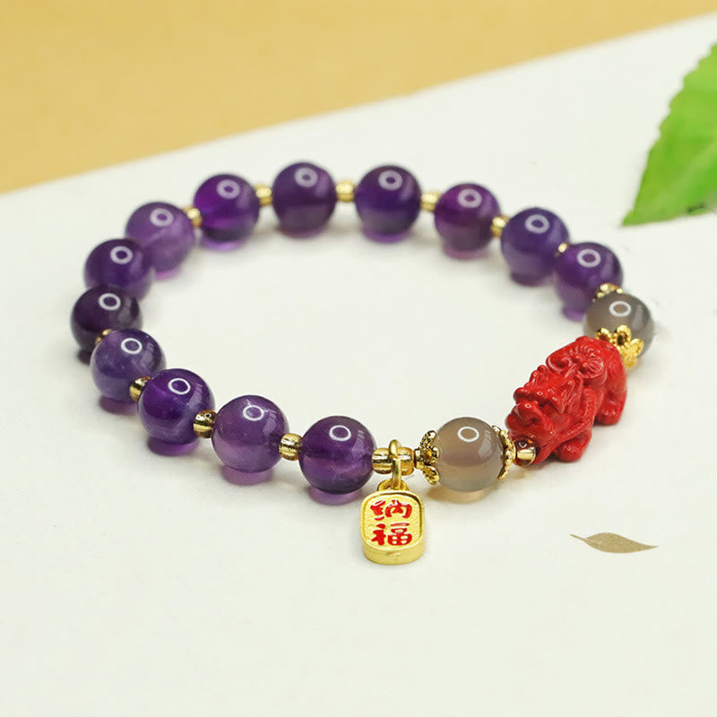 Amethyst Cinnabar Pi Xiu Fu Character Balance Bracelet – front view with Fu character pendant and red Pixiu center, amethyst healing bracelet