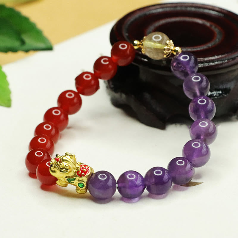 Natural Amethyst Red Agate PiXiu Balance Bracelet – close wood stand angle, enamel PiXiu detail, red purple crystal beads
