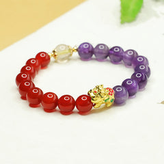 Natural Amethyst Red Agate PiXiu Balance Bracelet – angled with green leaf, red purple bead contrast, enamel gold PiXiu charm