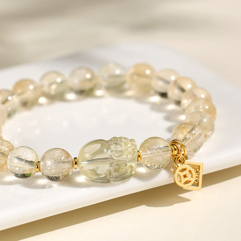 Natural Citrine PiXiu Copper Coin Wealth Bracelet – close-up white surface, citrine PiXiu carving, gold coin charm detail