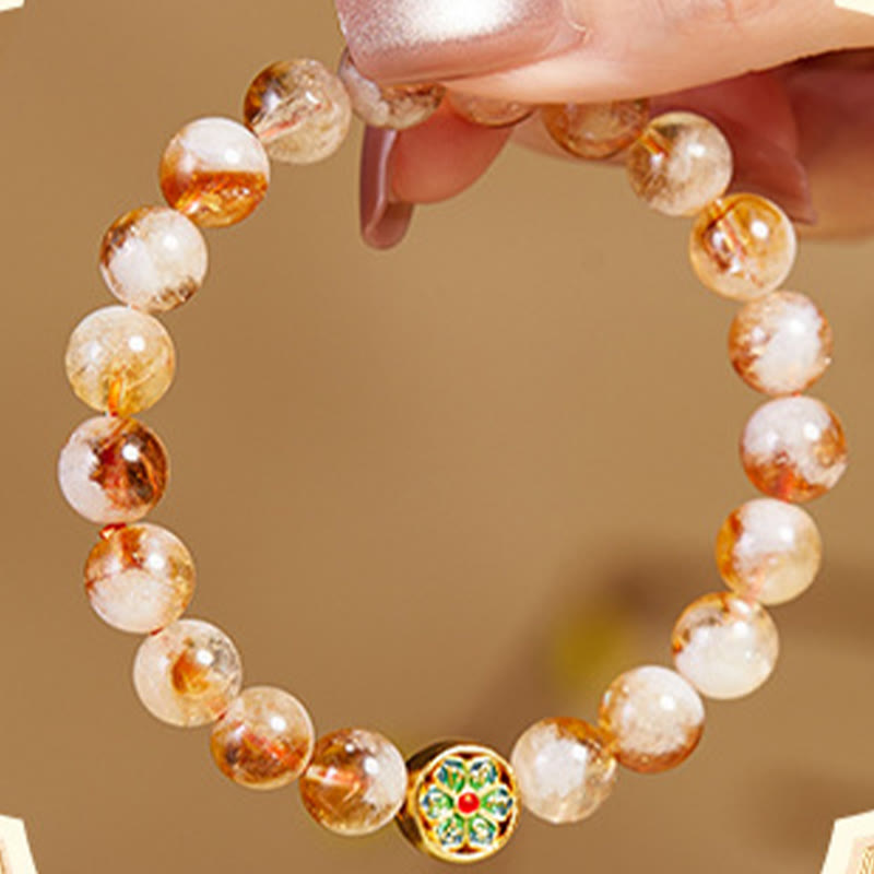 Sterling Silver Citrine Bracelet – held dangling, warm honey citrine beads with multicolor enamel accent, healing crystal
