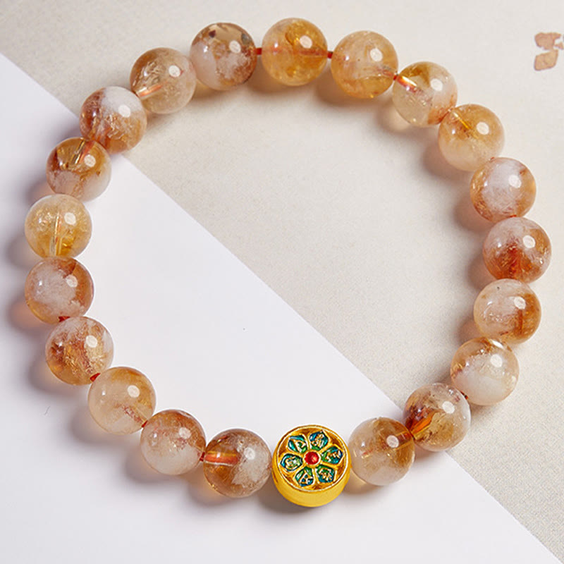 Sterling Silver Citrine Bracelet – top-down flat lay, golden citrine stones with mandala enamel bead, beaded stretch bracelet