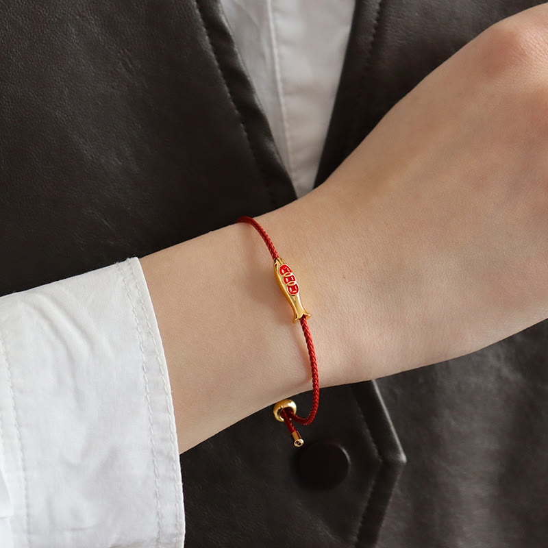 Brass Koi Fish Red String Bracelet – close-up gold fish charm, red enamel scales, braided red cord, lucky prosperity jewelry