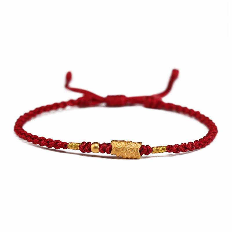 999 Gold Koi Fish Red String Bracelet – matte gold koi bead on red cord, white background, eye-level