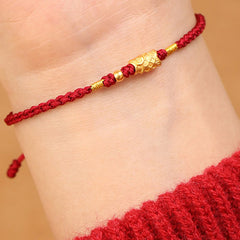 999 Gold Koi Fish Red String Bracelet – gold koi charm worn on wrist, lifestyle side view, protection