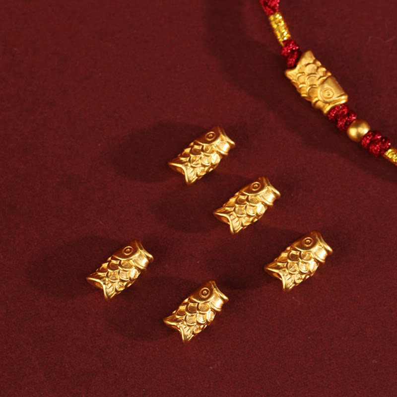 999 Gold Koi Fish Red String Bracelet – five loose gold koi charms and bracelet, components flat lay