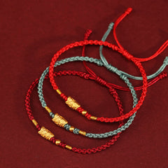999 Gold Koi Fish Red String Bracelet – three bracelets, red and teal cords, gold koi, flat lay, protection