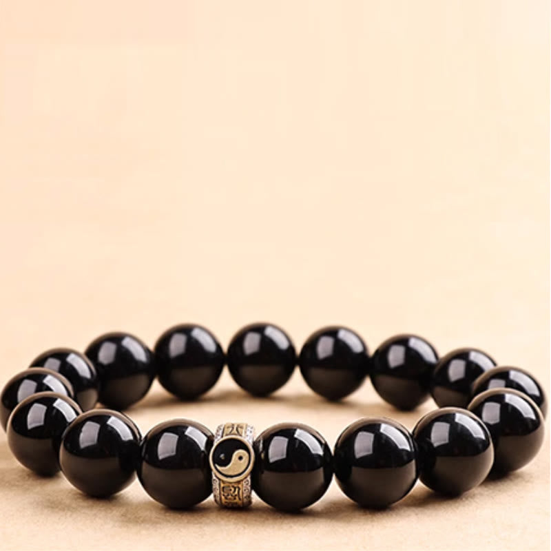 Black Obsidian Nine-Character Mantra Yin Yang Bracelet - gold yin-yang charm low-angle, men's obsidian bracelet