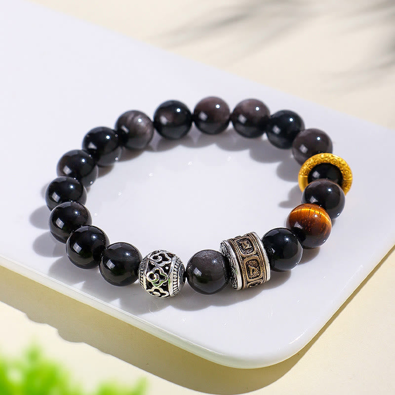 Silver Sheen Obsidian Tiger Eye Bracelet – three-quarter view showing glossy black beads, gold ring spacer and antique silver charm detail, spiritual men's jewelry