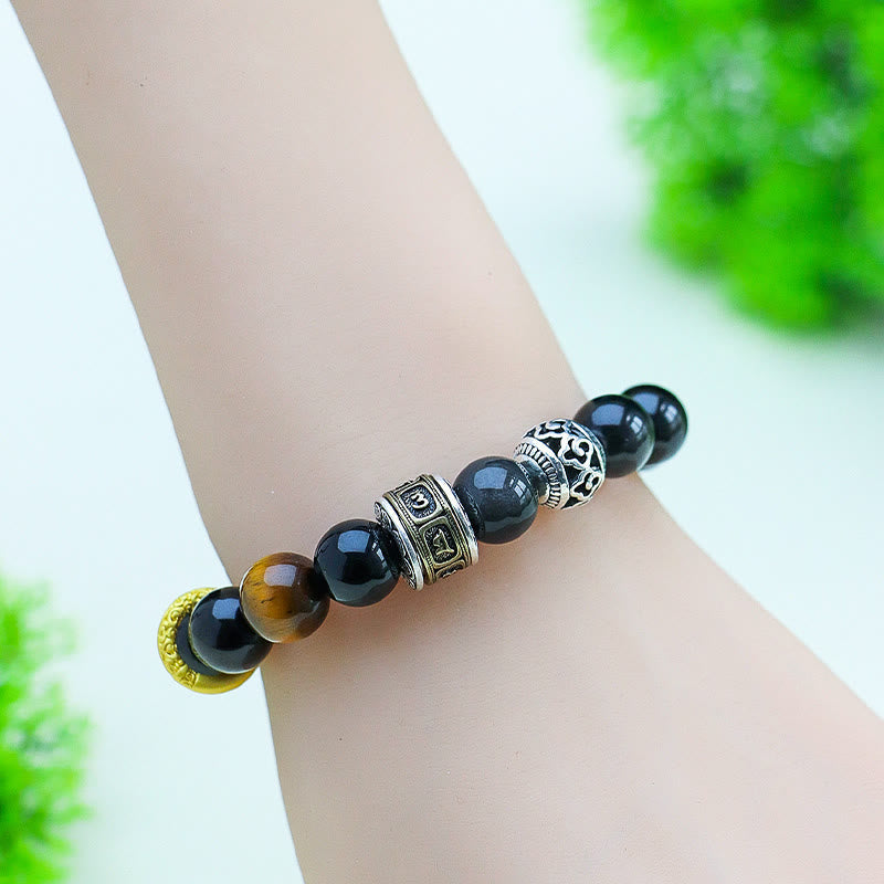 Silver Sheen Obsidian Tiger Eye Bracelet – worn on wrist showing natural drape, filigree silver spacer and amber tiger eye glow, masculine spiritual accessory