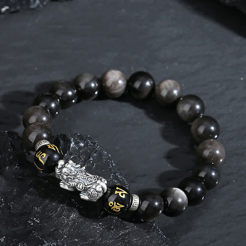 999 Sterling Silver Black Obsidian PiXiu Strength Bracelet – on dark slate rock, silver sheen bead glow, feng shui bracelet