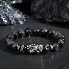 999 Sterling Silver Black Obsidian PiXiu Strength Bracelet – front dark surface, silver PiXiu center, feng shui good luck