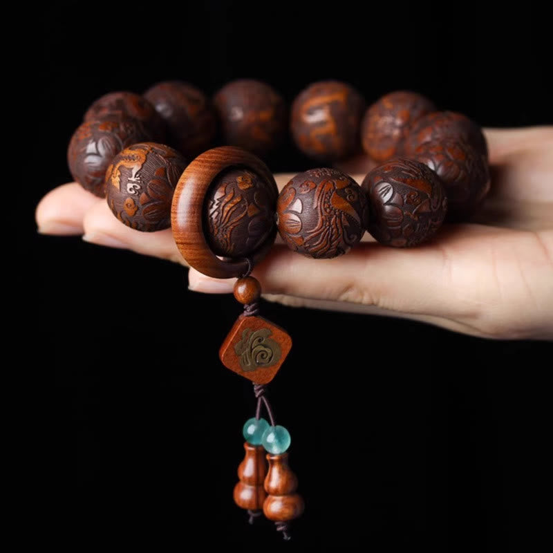 Rosewood Dragon Phoenix Gourd Bracelet – bracelet in open palm black background, Devotion