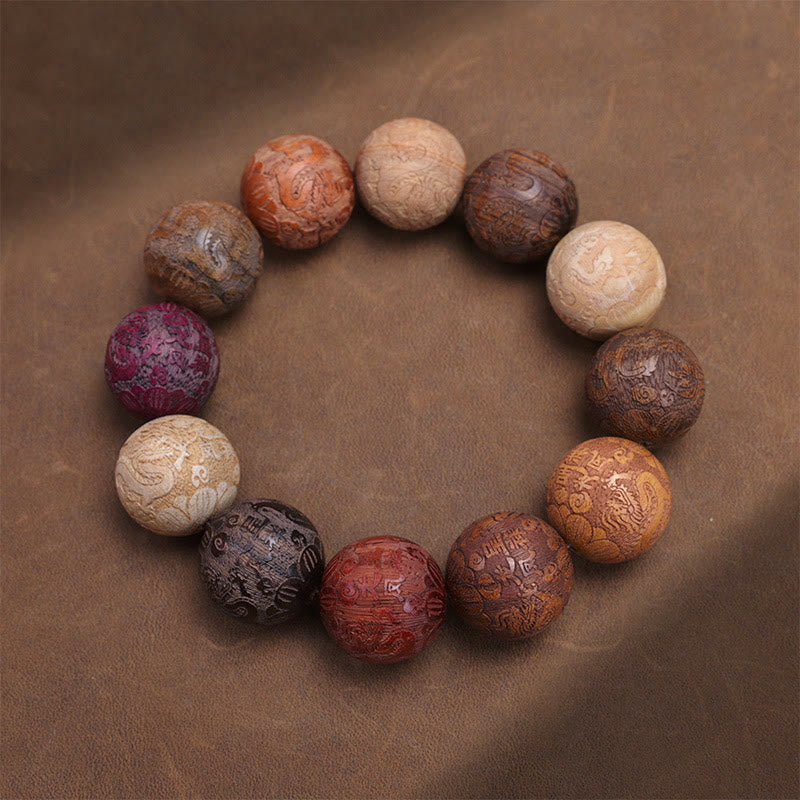Sandalwood Dragon Phoenix Zodiac Bracelet – multi-wood beads overhead dark brown surface, Balance