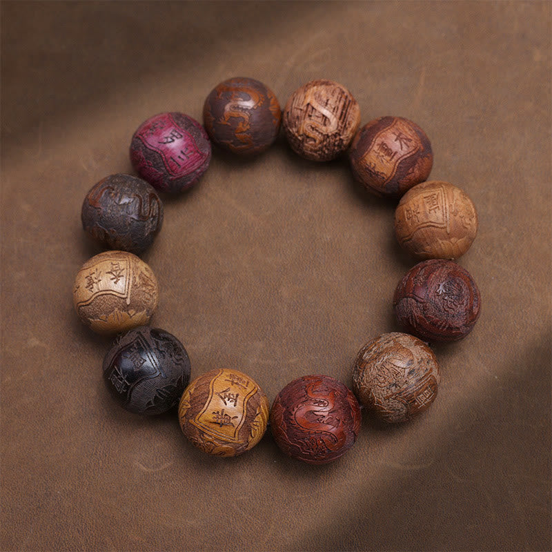 Sandalwood Dragon Phoenix Zodiac Bracelet – glossy carved beads flat lay brown, Craftsmanship