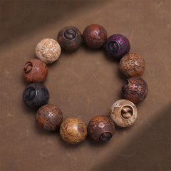 Sandalwood Dragon Phoenix Zodiac Bracelet – multi-wood zodiac beads overhead on brown texture, Healing