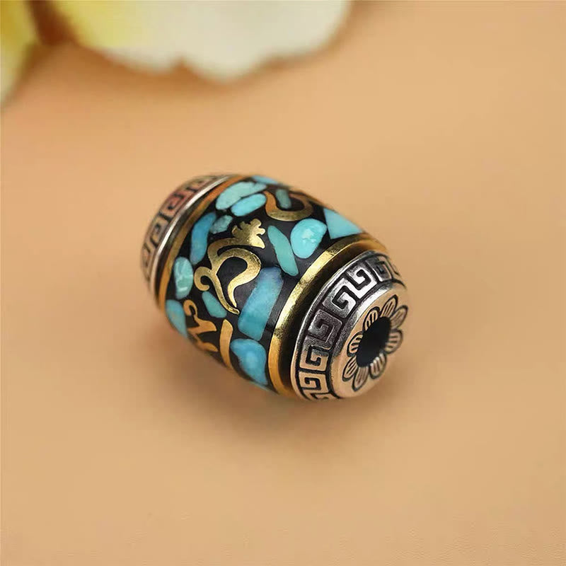 Dzi Bead Om Mani Padme Hum Rotatable Pendant – Isolated bead detail at 45-degree angle with bore hole and floral sunburst motif, tibetan bead