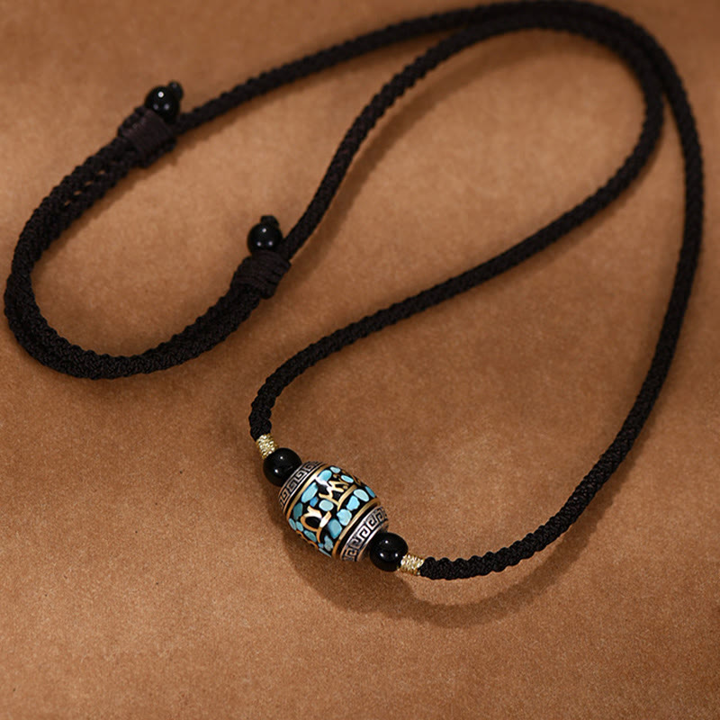 Dzi Bead Om Mani Padme Hum Rotatable Pendant – 45-degree angled S-curve display showing adjustable sliding knot, dzi bead necklace