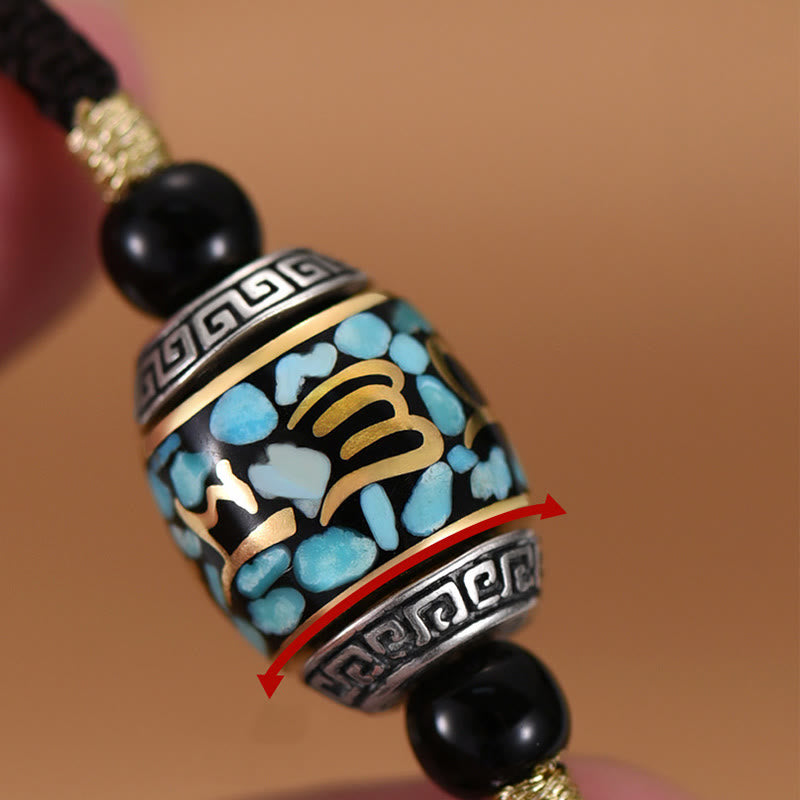 Dzi Bead Om Mani Padme Hum Rotatable Pendant – Close-up with red arrows demonstrating rotatable prayer wheel function, mani wheel pendant