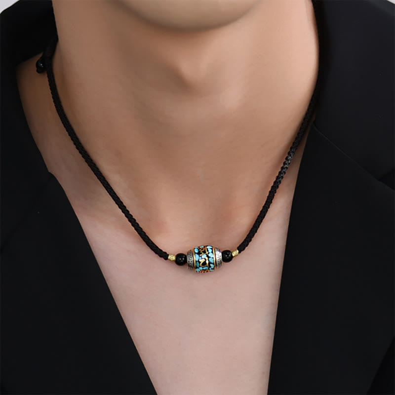 Dzi Bead Om Mani Padme Hum Rotatable Pendant – On-model neck close-up worn as choker with adjustable black cord, tibetan jewelry