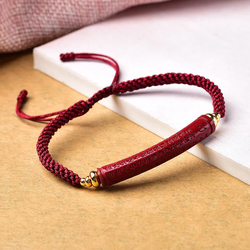 Cinnabar Heart Sutra Blessing Bracelet – side view showing engraved text with gold spacer beads, Buddhist bracelet