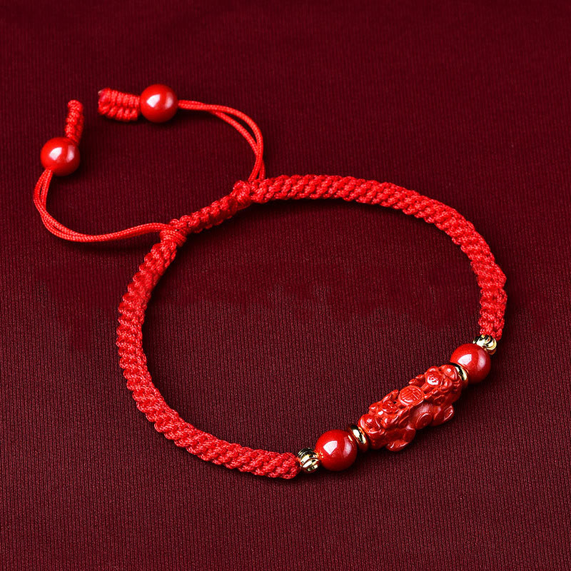 Handcrafted Cinnabar PiXiu bracelet – red braided bracelet side view with adjustable knots, good luck