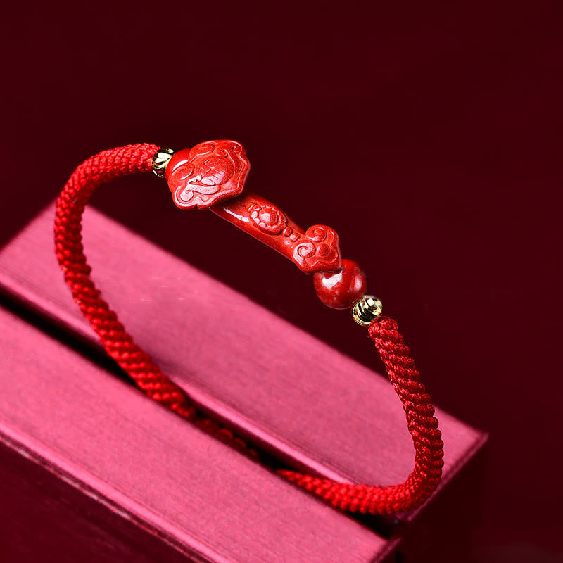 Handcrafted Cinnabar Ruyi bracelet – red braided bracelet with Ruyi stick on red book display, feng shui