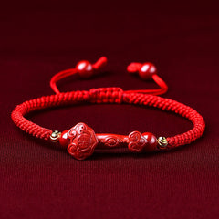 Handcrafted Cinnabar Ruyi bracelet – red braided cord with cinnabar Ruyi stick charm, good fortune