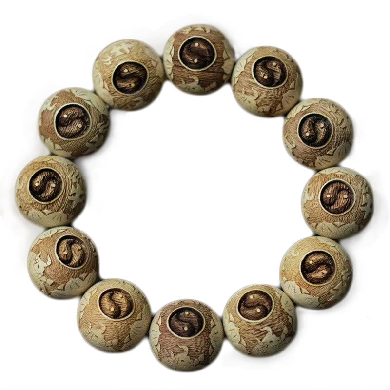 Camphor Wood Yin Yang Ox Engraved Bracelet - yin-yang beads top-down white background, wood bracelet