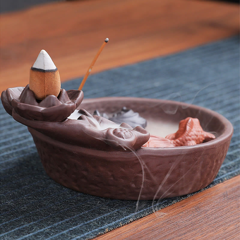 Koi Fish Ox Purple Clay Incense Burner – basketry-textured bowl, koi and shell in thin smoke, side view