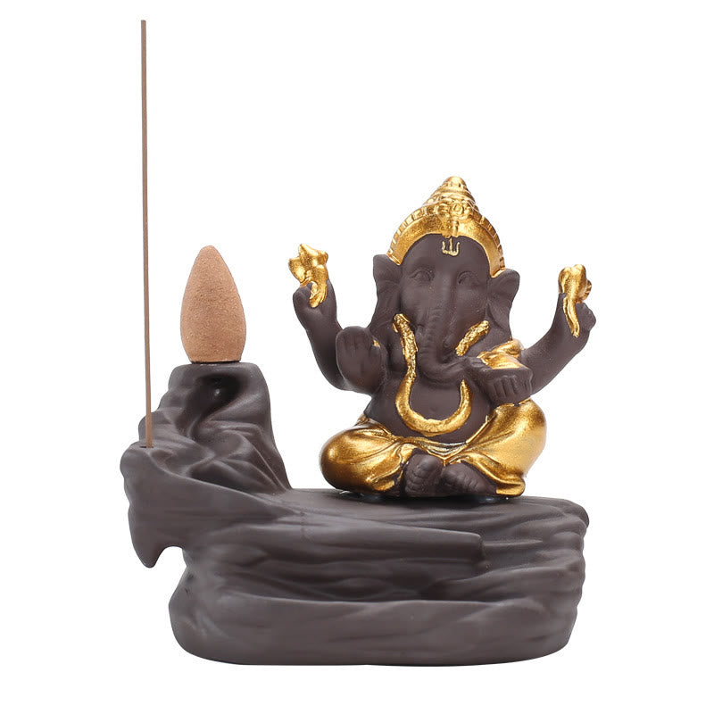 Ganesh Backflow Incense Burner - Gold and charcoal Ganesha on pure white studio background, dual incense holder