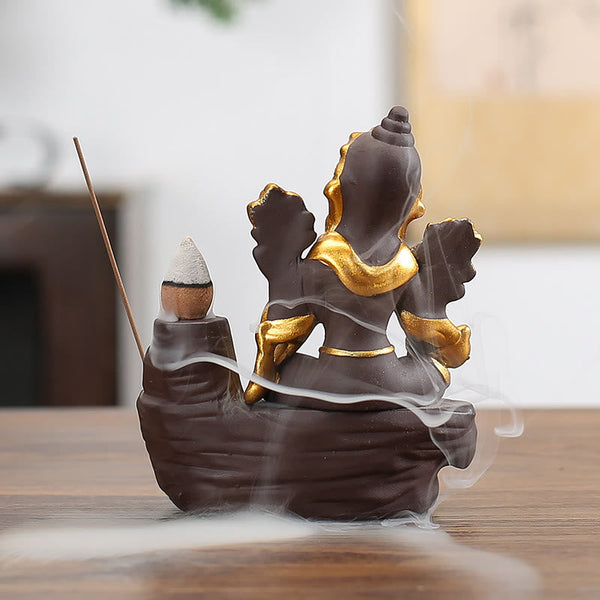 Ganesh Backflow Incense Burner - Rear angle of gold-detailed Ganesha with smoke pooling at base, backflow effect