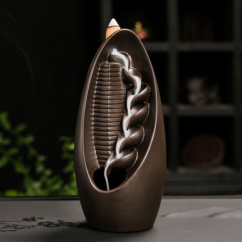 Mountain Water Buddha Hand Incense Burner – Dark brown teardrop with braided channel, flowing smoke