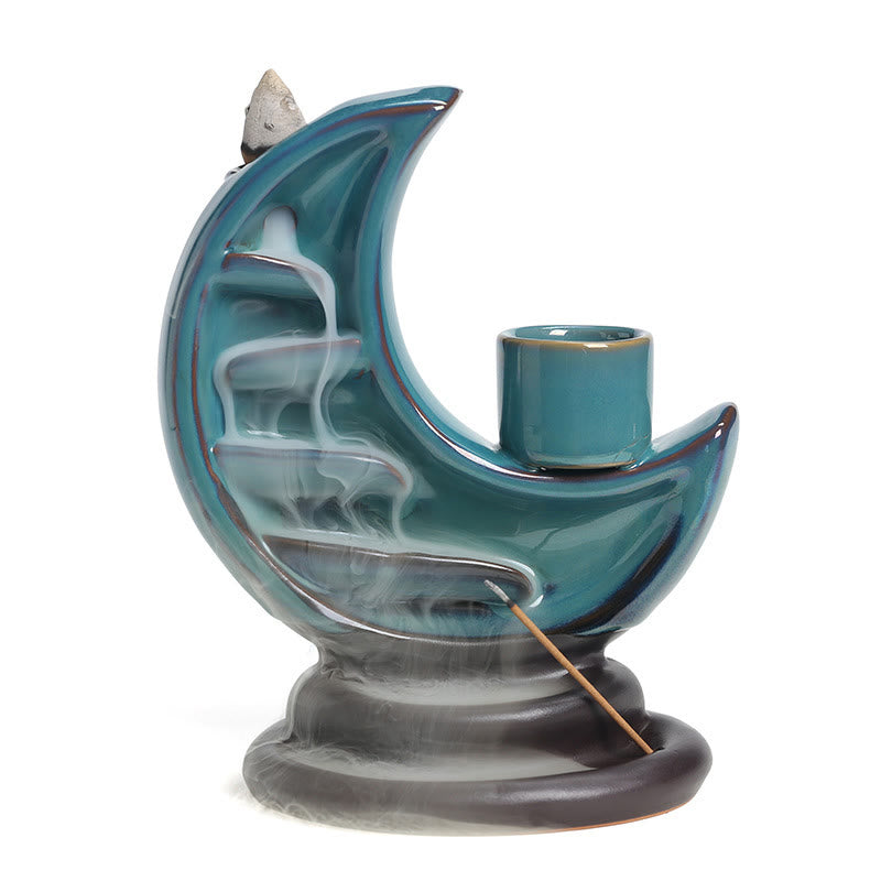 Crescent Moon Incense Burner – Full view with backflow smoke on white background, teal ceramic moon, calm