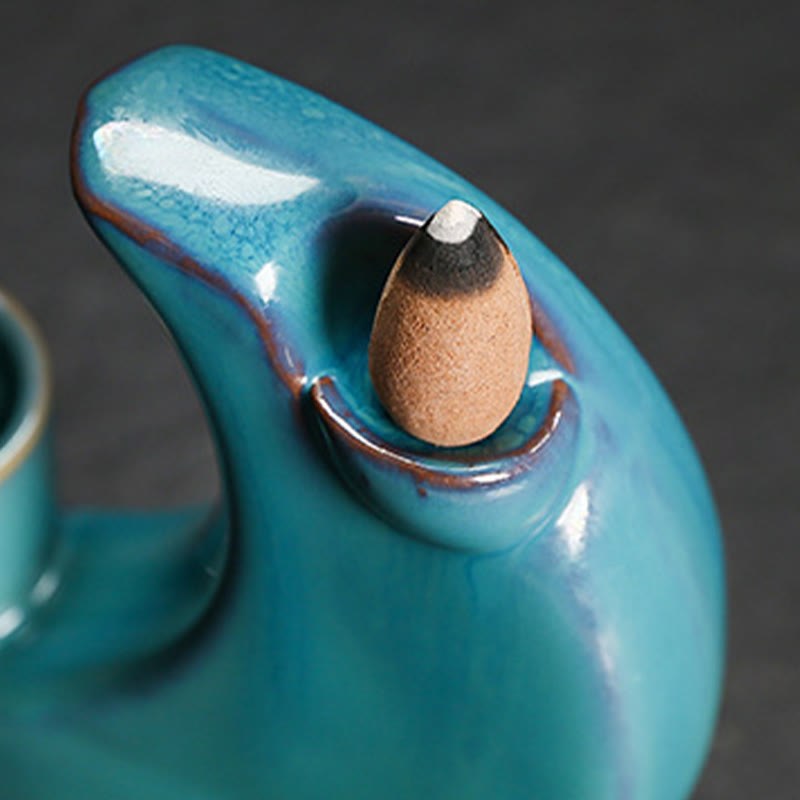 Crescent Moon Incense Burner – Close-up of burning backflow cone in teal crackle glaze holder, serenity