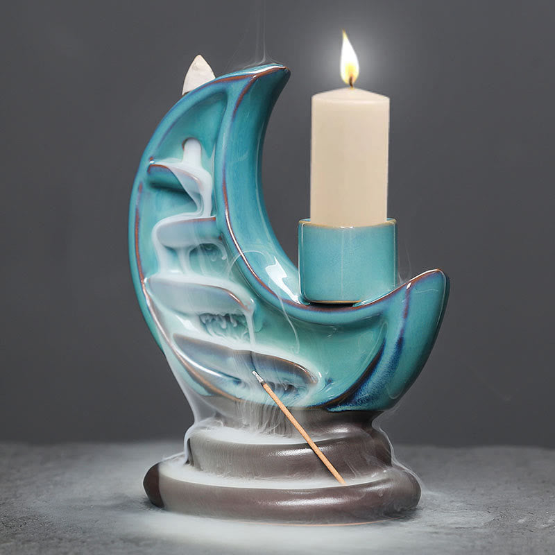 Crescent Moon Incense Burner – Glowing candle flame and backflow smoke on turquoise crescent, calm decor