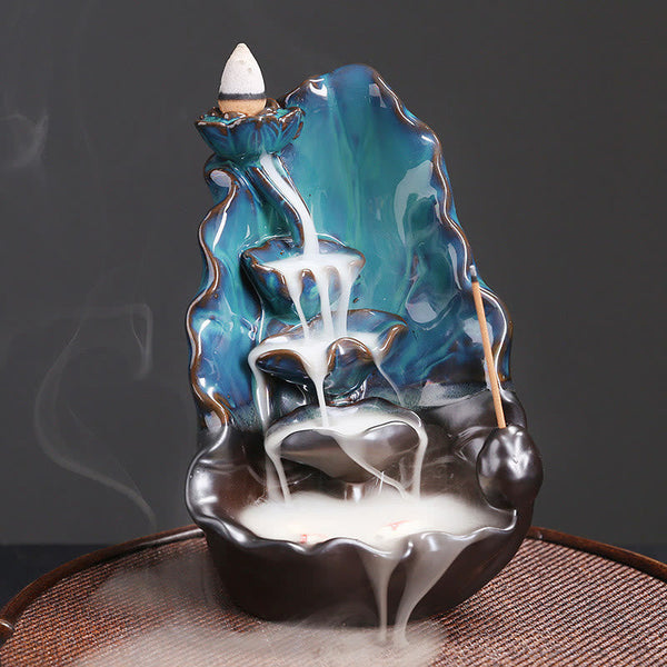 Ceramic Backflow Incense Burner – Smoke cascading down teal lotus tiers with stick incense, backflow incense