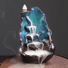 Ceramic Backflow Incense Burner – Smoke cascading down teal lotus tiers with stick incense, backflow incense