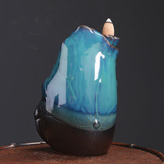Ceramic Backflow Incense Burner – Unlit teal ceramic with bronze accents, cone ready to light, backflow incense