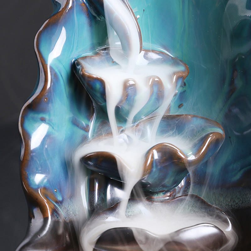 Ceramic Backflow Incense Burner – Close-up of smoke flowing through mid-tier turquoise pools, backflow incense