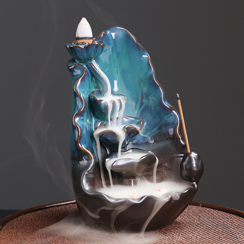 Ceramic Backflow Incense Burner – Low-angle view of white smoke waterfall over blue-green glaze, backflow incense