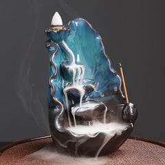 Ceramic Backflow Incense Burner – Low-angle view of white smoke waterfall over blue-green glaze, backflow incense