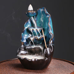 Ceramic Backflow Incense Burner – Active smoke cascade on dark background with unlit incense stick, backflow incense