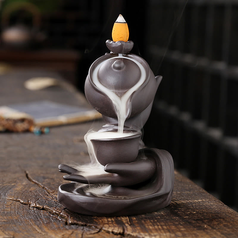 Buddha Hand Teapot Incense Burner – Teapot pours smoke into cup, stacked on open palm, backflow effect